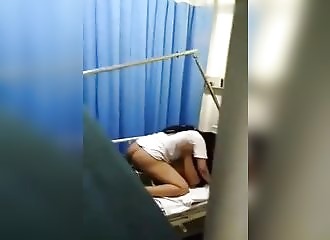 A doctor surprises patients fucking in the hospital room